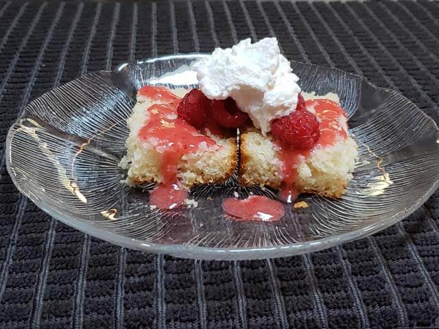 Image of a piece of strawberry-topped vanilla cake